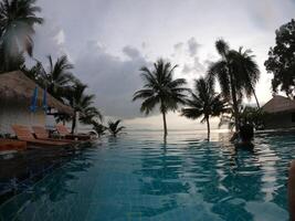 Sea with resort and beach chairs photo