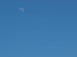 Blue sky with the moon photo