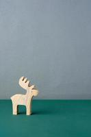 wood reindeer toy on green table photo