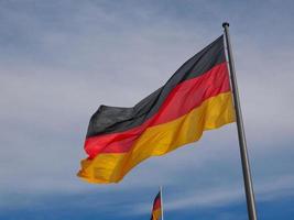 German flag over blue sky photo