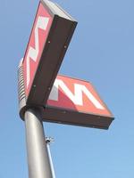 Subway sign over blue sky photo