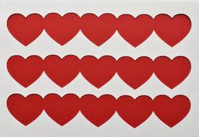 Red Valentines Hearts on white background. Place for text, copy space. Top view. Happy Valentine's Day concept. photo