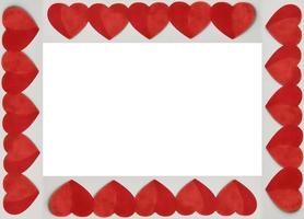 Red Valentines Hearts around a white square background. Place for text, copy space. Top view. Happy Valentine's Day concept. photo