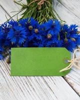 paper tag with  cornflowers photo
