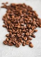Coffee beans on a stone background