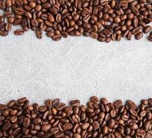 Coffee beans on a stone background photo