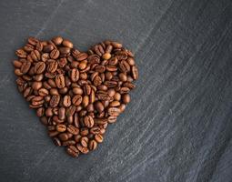 Coffee beans in the form of heart photo