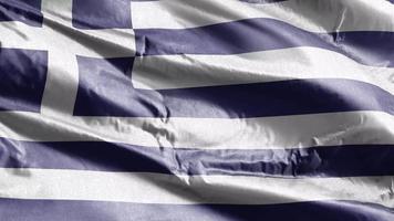 bandera textil de grecia ondeando en el bucle de viento. estandarte griego balanceándose con la brisa. tejido textil tejido. fondo de relleno completo. Bucle de 10 segundos. video