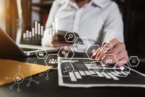 Businessman working with smart phone and laptop and digital tablet computer in  office with digital marketing media  in virtual icon photo