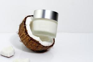 Cosmetic cream with coconut, face and body treatment photo