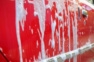 Washing red car photo