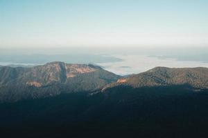 morning light and mountains,mountains in summer morning and spring flowers photo