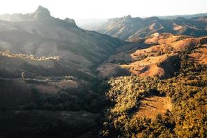 mountains and orange grass in the evening photo