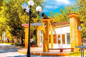 Evpatoria, Crimea-may 23, 2018 -Urban landscape of the resort city in the summer season. People walk along shady alleys. photo