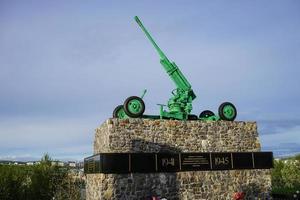 Murmansk, Russia-June 5, 2015 -Museum of military equipment with weapons against the sky and trees. photo