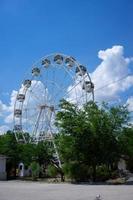 Evpatoria, Crimea - may 24, 2018 - Beautiful and modern Ferris wheel on blue sky background. photo