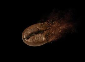 close up of coffee beans splashing photo