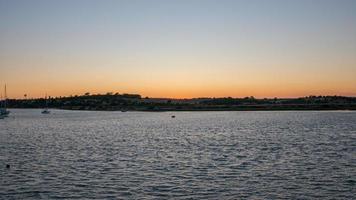 Beautiful sunset at Alvor, Algarve, Portugal photo