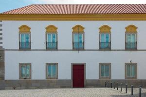 Colorful state building at Evora, Portugal. Public Library. Outdoors, no people. photo