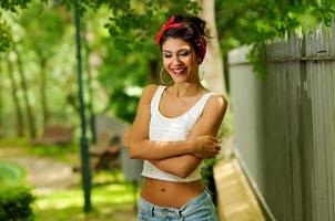 Pin-up girl. American style, in a garden photo