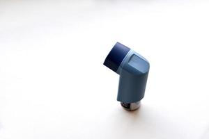 Asthma inhaler spray on a white background photo