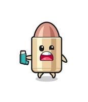 bullet mascot having asthma while holding the inhaler vector