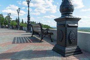 bench on the observation deck against the sky photo