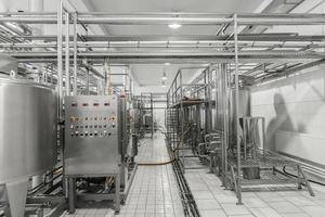 general view of the interior of a milk factory. equipment at the dairy plant photo