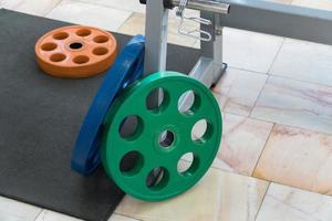 sports equipment and barbells in the gym, closeup photo