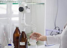 woman testing samples of dairy products in the laboratory. test laboratory of a milk factory photo