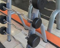 sports equipment and barbells in the gym photo