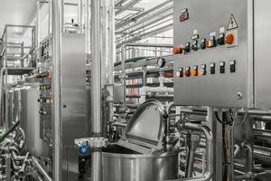 electronic control panel and tank at a milk factory. equipment at the dairy plant photo