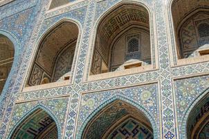 Arch and architecture of the ancient Registan in Samarkand. Ancient architecture of Central Asia photo