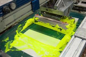 equipment and machines for painting cloth at a garment factory closeup photo