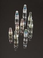 medical ampoules for injections on a dark background with reflection photo