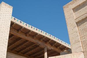 Ancient wooden ceiling in Bukhara, Central Asia photo