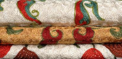 Background from the tissue with oriental ornaments and multi colored pattern, textile photo