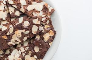 Brownie Cracker with Almond Slides on White Background photo