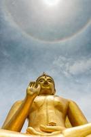 The buddha at the top of ring around the sun photo