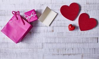 Valentine's Day Abstract Background with Hearts on Wood Texture photo