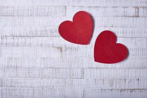 Valentine's Day Abstract Background with Hearts on Wood Texture photo