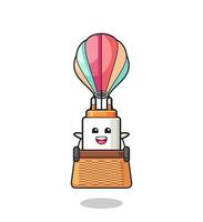 power adapter mascot riding a hot air balloon vector