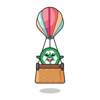 mascota de reciclaje montando un globo aerostático vector
