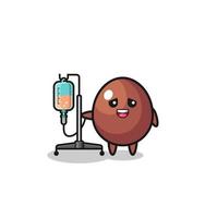 cute chocolate egg character standing with infusion pole vector