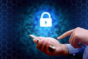 Cyber security concept. businessman using smartphone with lock network icon. photo
