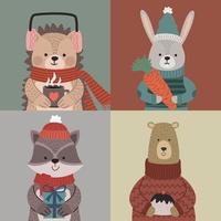four animals wearing winter clothes