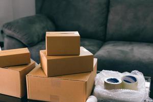 Parcel boxes and equipment for packaging placed on the table. photo