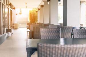 Empty tables and chair at outdoor restaurant. photo