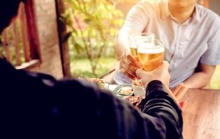 After work time with two asian man drinking beer. photo