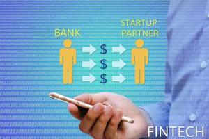 Financial and Technology FinTech concept. Banker to hire partners to prepare applications and mobile applications related to online transactions. photo